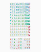 A sheet of small square stickers or icons arranged in rows on a white background, with two larger sheets below showing colorful symbols and illustrations including trees, birds, flowers, and red foxes.