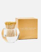 Match striker with gold matches and a matching box on a white background