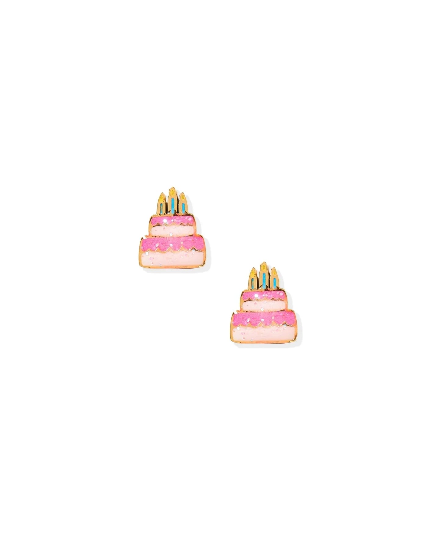 Pair of earrings shaped like birthday cakes with pink frosting and candles on a white background