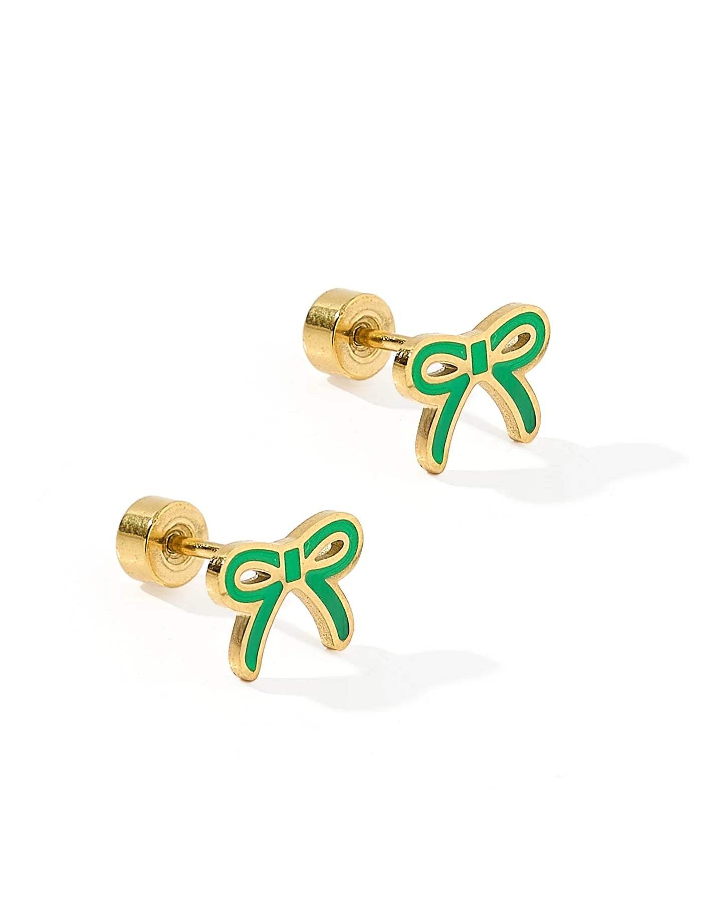 Gold and green bow-shaped earrings on a white background
