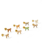 Set of gold bow-shaped earrings on a white background