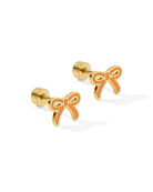 Gold bow-shaped earrings on a white background