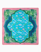 Decorative blanket with a colorful pattern on a pink background
