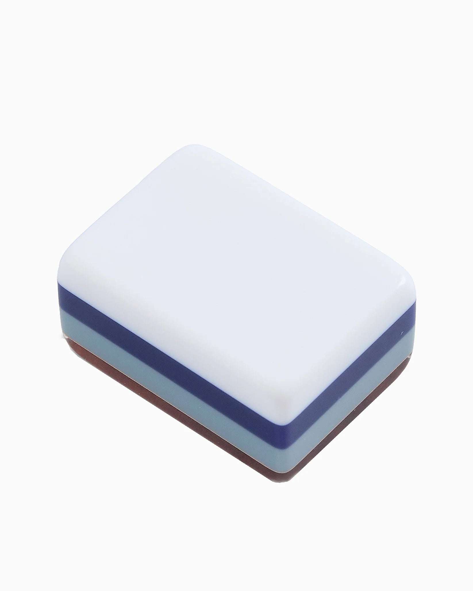 A small rectangular box with rounded corners, featuring a white top lid and stacked blue and brown bands on the sides, shown on a plain white background.