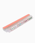 Rectangular container with pink top and colorful labels on a white background