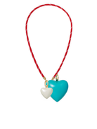 Necklace with heart-shaped pendants on a red cord against a white background
