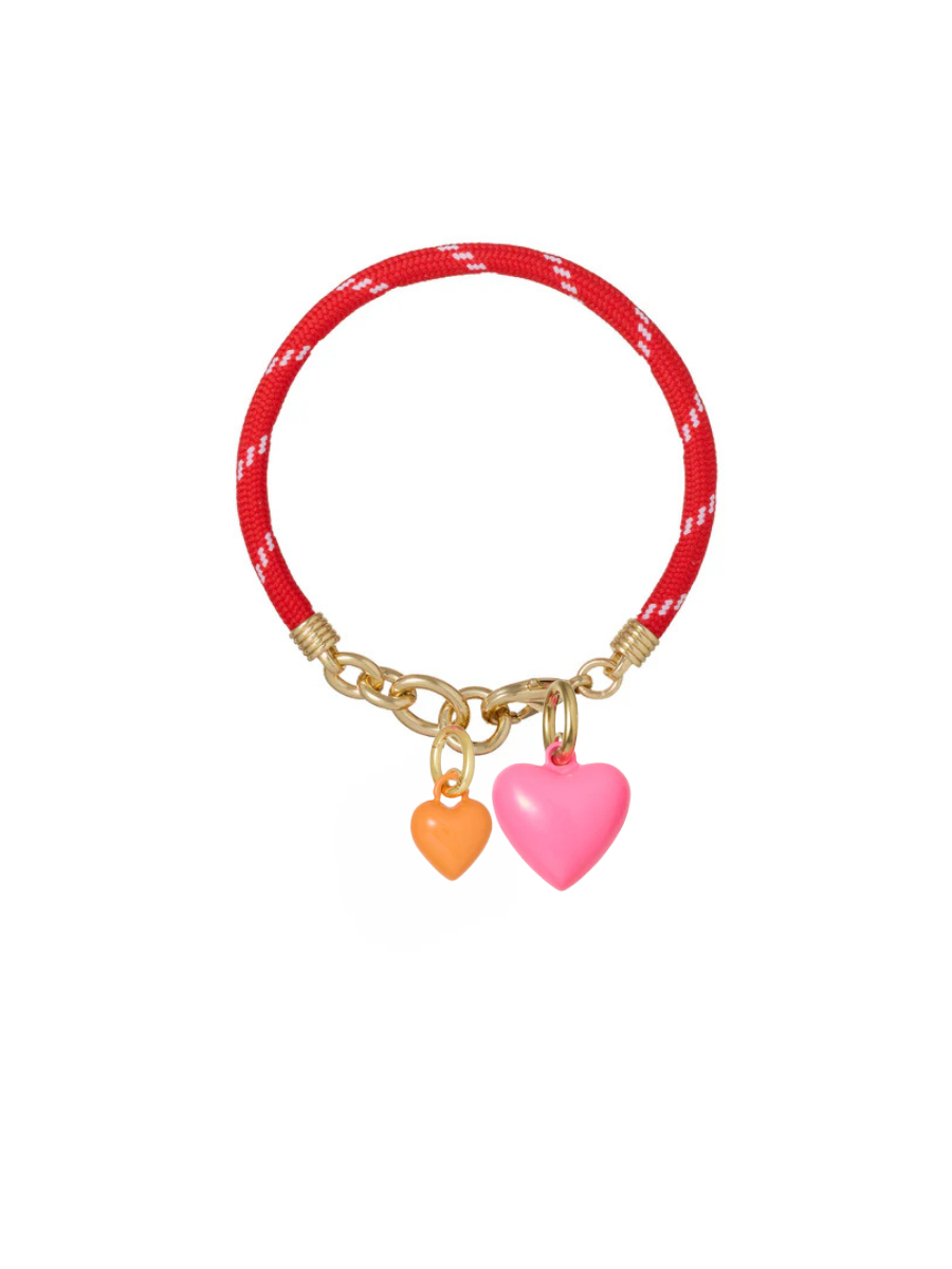 Red bracelet with gold clasp and heart-shaped charms on a white background