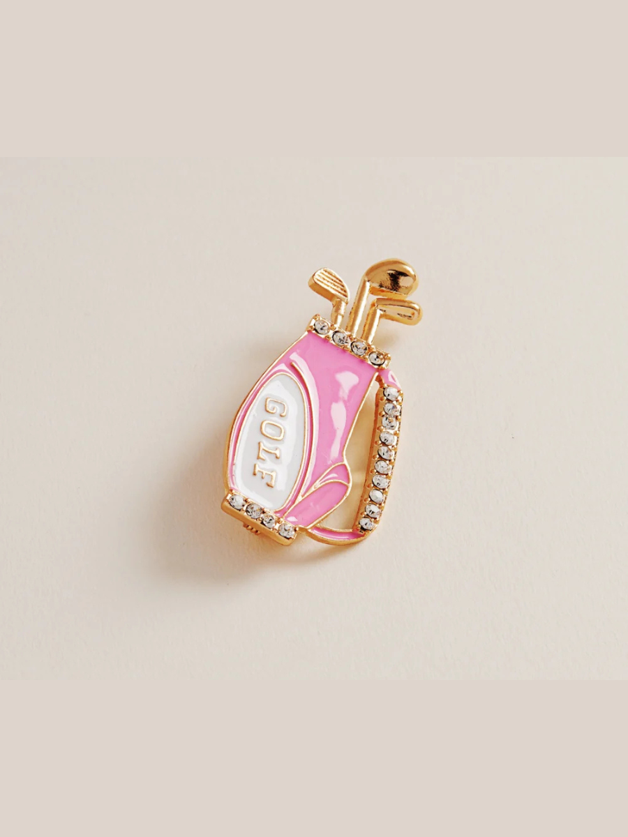 Pink golf club-shaped earring with gold accents on a beige background