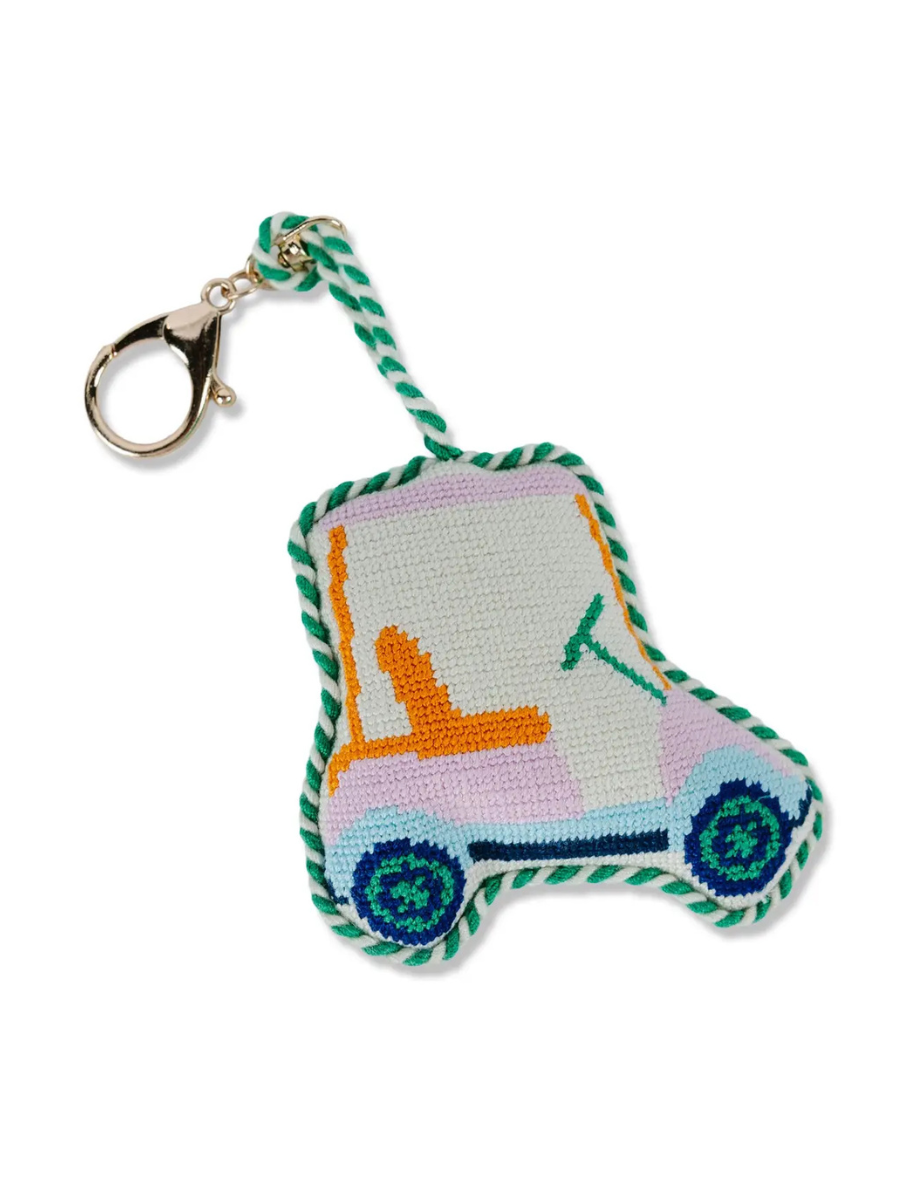 Embroidered keychain shaped like a car on a white background