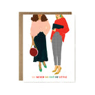 Illustration of two women in stylish outfits with text 'We never go out of style' on a white background.