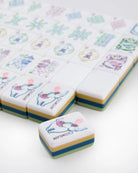 Decorative tiles with cartoon elephant designs on a white background