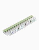 Set of colorful tiles with letter designs on an acrylic clear rack with a white background