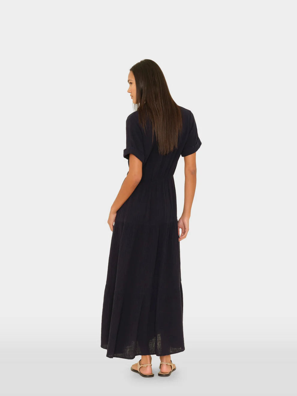 Woman wearing a black dress on a white background