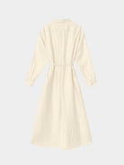 Beige dress with a belt on a light gray background