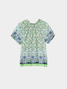 Green and blue patterned shirt on a white background