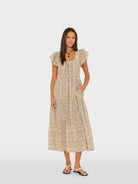 Woman wearing a floral dress on a white background