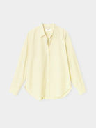 Yellow striped shirt on a light gray background