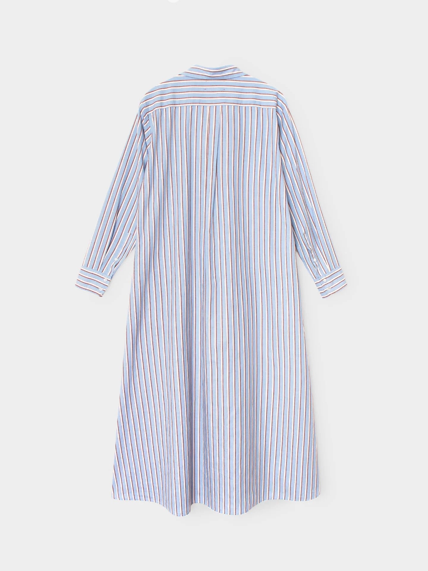 A long-sleeve shirt dress with vertical blue, white, and red stripes, shown from the back against a light gray background.