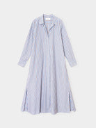 A long-sleeve button-front shirt dress with vertical blue and white stripes, shown flat against a light gray background.