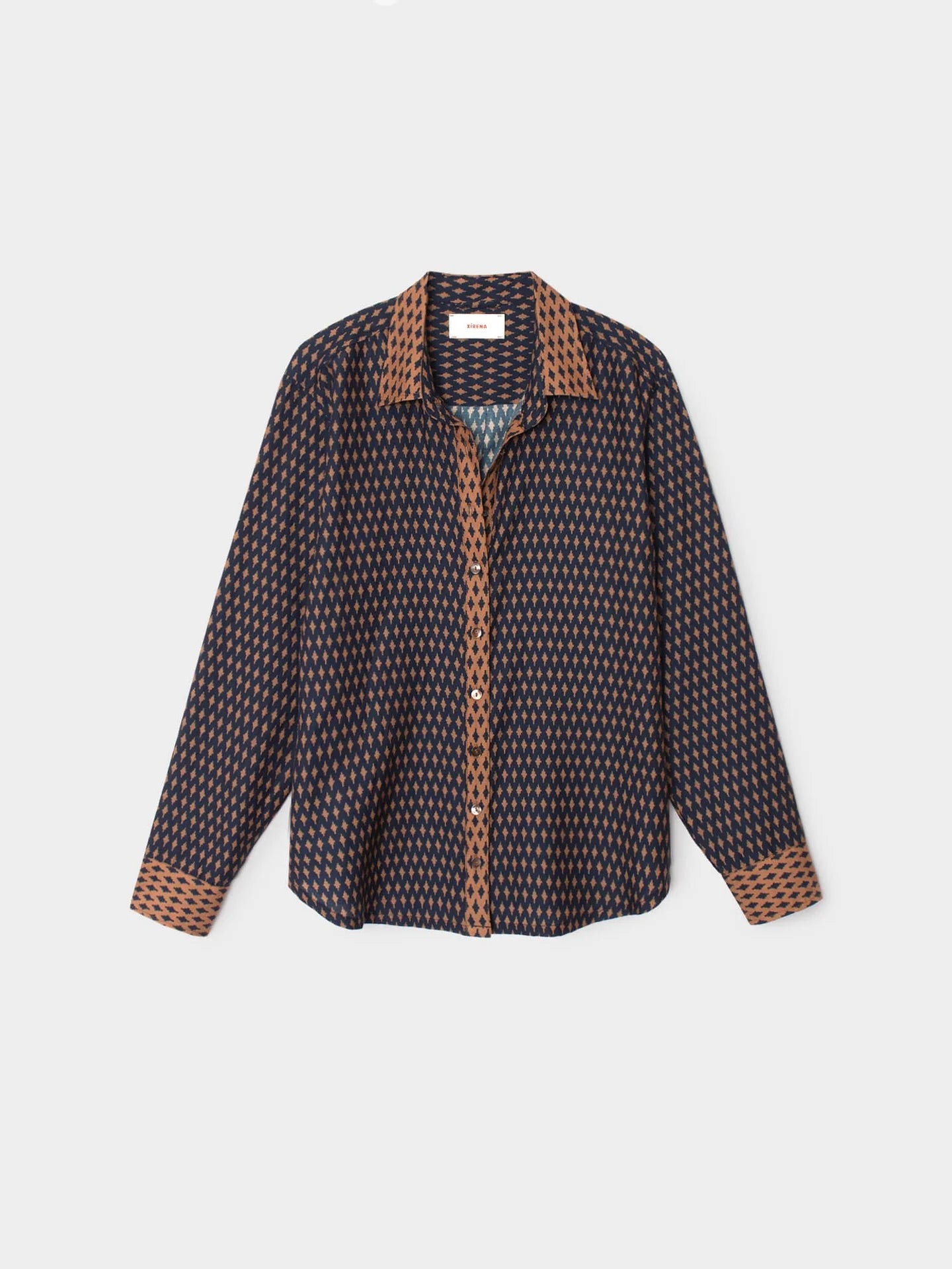 Patterned shirt with brown accents on a light gray background